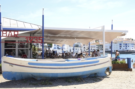 People at lunch in a beach restaurant on a summer day at the beach of  Cadaques, a town  in the province of Girona, Catalonia, Spain.のeditorial素材
