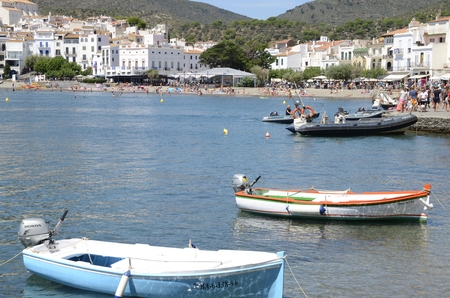 Boats at  foreground  of the beach in the coastal village Cadaques, Girona, Catalonia, Spain.のeditorial素材