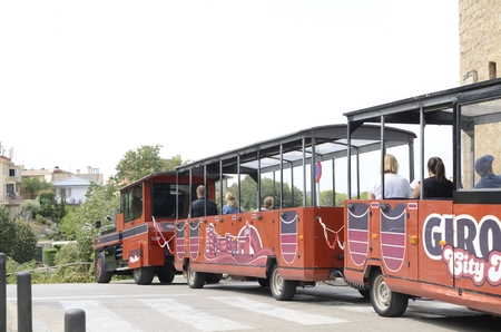 People at touristic bus by  old town of Girona,  Catalonia, northeastern Spain.のeditorial素材