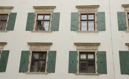 Green shutters of windows  on building  in  Graz, the capital of federal state of Styria, Austria. の写真素材