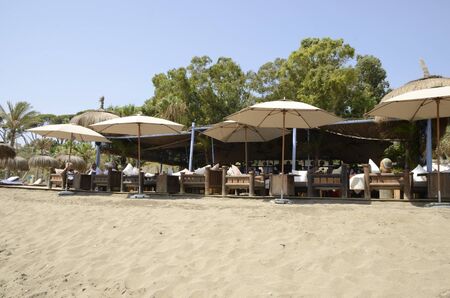 Marbella, Spain - August 31, 2018: People at exterior terrace of restaurant at the beach in  Marbella, Andalusia, Spain.のeditorial素材