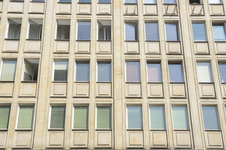 Windows aligned on building facade in Warsaw, Poland.