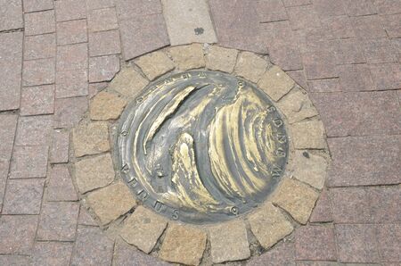 Warsaw, Poland - July 29, 2018: Bronze Venus planet on the ground at  Copernicus Plaza in Warsaw,...