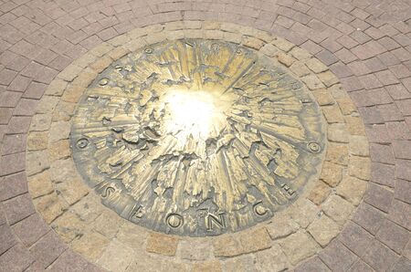 Warsaw, Poland - July 29, 2018: Bronze Sun  on the ground at  Copernicus Plaza in Warsaw, Poland.のeditorial素材