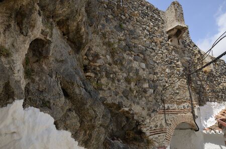 Stone wall  in Casares, a mountain Andalusian white village of Malaga province, Andalusia, Spain.の写真素材