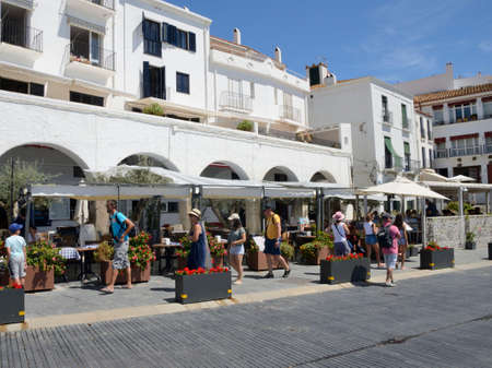 Cadaques, Spain - July 27, 2017: People walking by  the promenade of Cadaques, a town  in the province of Girona, Catalonia, Spain.のeditorial素材
