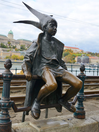 Budapest, Hungary - October 22, 2021: Street bronze statue of the Little Princess sitting on the railings of the Danube promenade in Budapest, Hungary.のeditorial素材