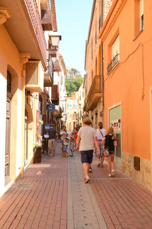 Begur, Spain - July 25, 2017: People walking by narrow alley in the old town of Begur, Catalonia, northeastern Spain.のeditorial素材