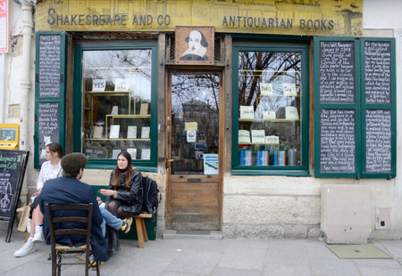 Paris, France - March 17, 2023: People at exterior of iconic bookshop Shakespeare and Company in the Latin Quarter in Paris, France.のeditorial素材