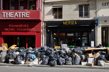 Paris, France - March 16, 2023: A lot of garbage piled up at street because of the strike in Paris, France.のeditorial素材