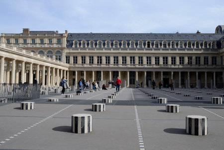Paris, France - March 16, 2023: People on columns at Courtyard of Honor in the Royal Palace gardens of Paris, France.のeditorial素材