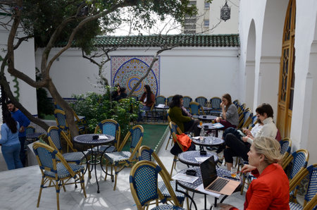 Paris, France - March 17, 2023: People in outdoor teahouse located in courtyard of the Mosque of...
