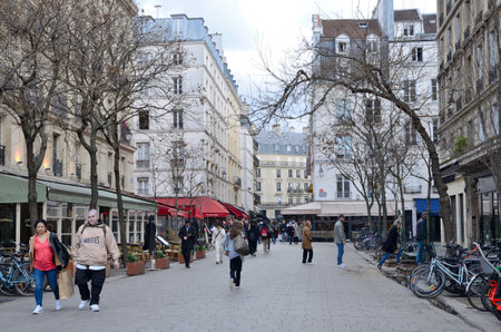 Paris, France - March 18, 2023: People at pedestrian street in the first district of Paris, France.のeditorial素材
