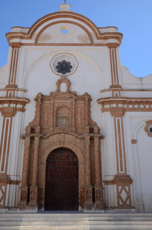 Main entrance to Our Lady of Granada Church in plaza of Moguer, an Andalusian village of Huelva, Spain.の写真素材
