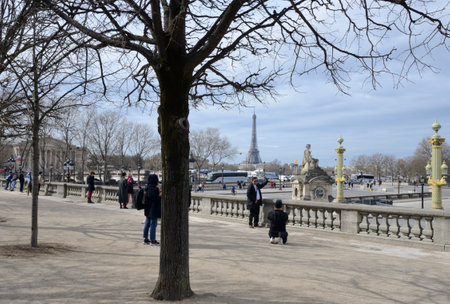 Paris, France - March 20, 2023: People at Plaza of Concord with views of the Eiffel Tower in Paris, France.のeditorial素材