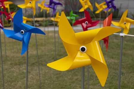 a yellow pinwheel that stopped spinning for a whileの写真素材