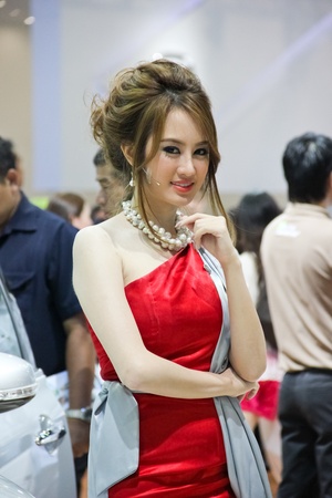 BANGKOK, THAILAND - MARCH 28 : An unidentified female presenter present at Nissan booth in the Thailand International Motor show 2012 at IMPACT on March 28, 2012 in Bangkok, Thailand.のeditorial素材