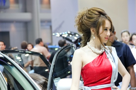 BANGKOK, THAILAND - MARCH 28 : An unidentified female presenter present at Nissan booth in the Thailand International Motor show 2012 at IMPACT on March 28, 2012 in Bangkok, Thailand.のeditorial素材