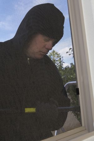 Burglar breaking into の写真素材