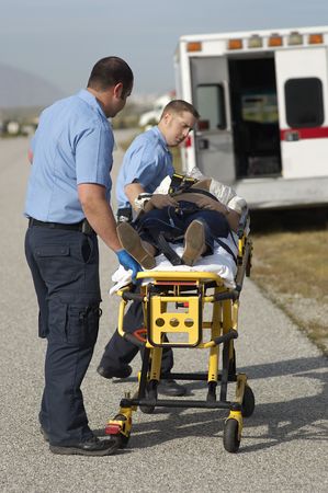 Paramedics transporting victim on stretcher