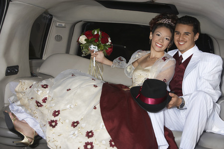 Bride and groom in limousineの写真素材