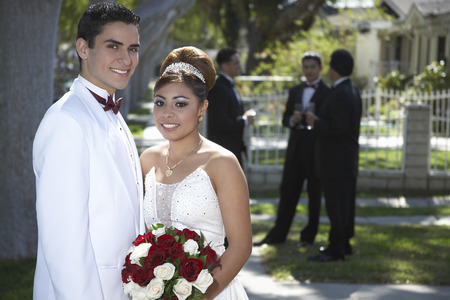 Portrait of wedding couple in gardenの写真素材