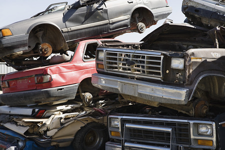 Stacked cars in junkyard