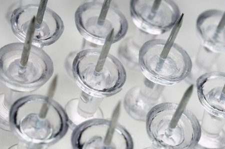 Transparent thumbtacks, close-upの写真素材