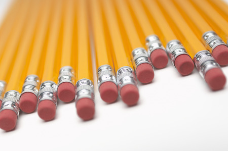Row of yellow pencils, close-up of erasers