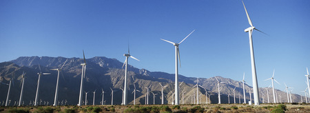 Valley of wind turbines in desert