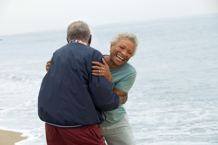 Frisky Mature Couple at Beachの写真素材