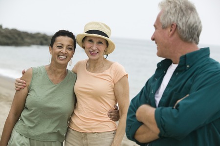 Three friends on beachの写真素材