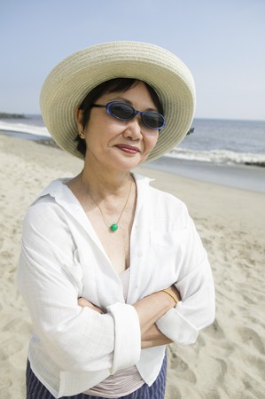 Middle-aged woman on beachの写真素材