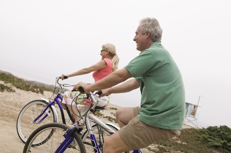 Middle-aged couple riding bicycles