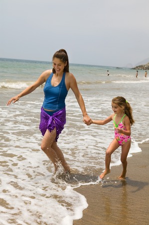 Mother and Daughter Getting Feet Wetの写真素材