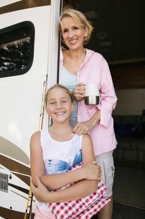 Mother and Daughter in Doorway of RVの写真素材