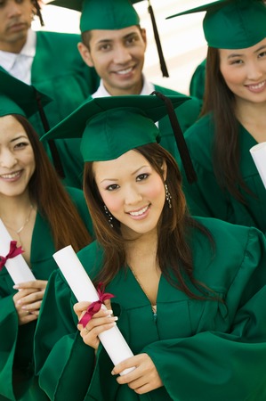 Graduates Holding Diplomasの写真素材