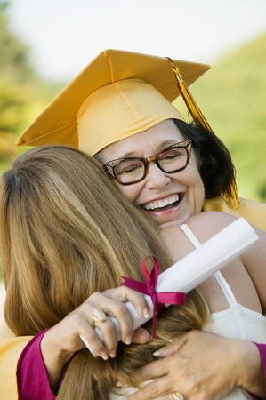 Graduate Hugging Womanの写真素材