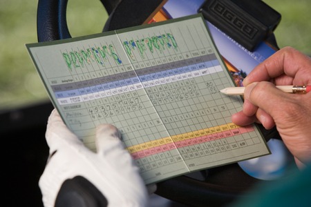 Golfer Marking Score on Scorecardの写真素材