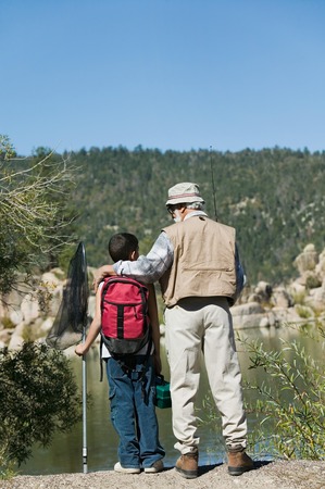Grandfather and Grandson Fishing at Lake