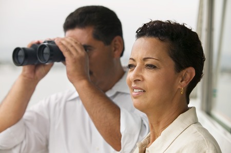 Couple on Boat with Binocularsの写真素材