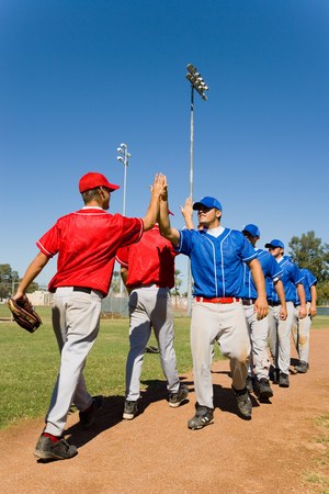 Teams High-Fiving Each Otherの写真素材
