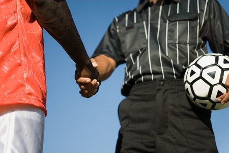 Referee and Player Shaking Hands
