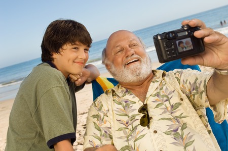 Boy and Grandfather Taking Pictureの写真素材