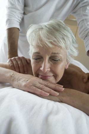 Senior woman having massageの写真素材
