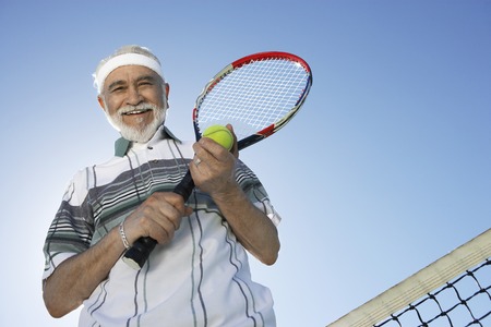 Smiling Man on the Tennis Courtの写真素材