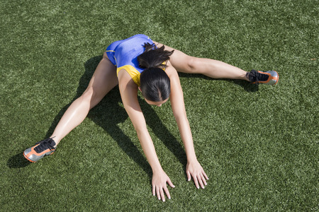Female athlete stretching