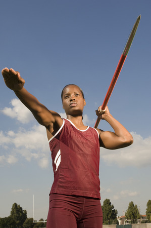 Female athlete throwing javelinの写真素材