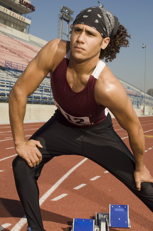 Runner on a track, stretchingの写真素材
