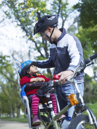 Father and Daughter on Bike Rideの写真素材